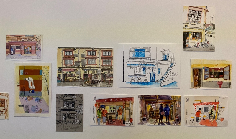 墙上展出的画作，记录了老公寓附近社区的众多生活场景。佟鑫摄